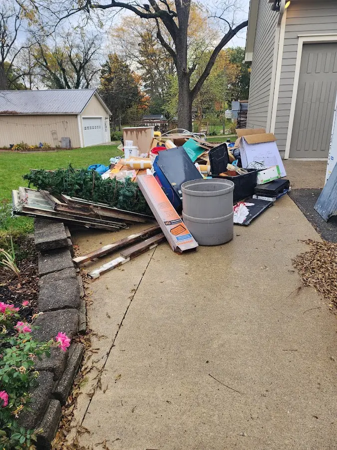 Dumpster being loaded with debris for 3 Yard Dumpster Rental in Brooksville